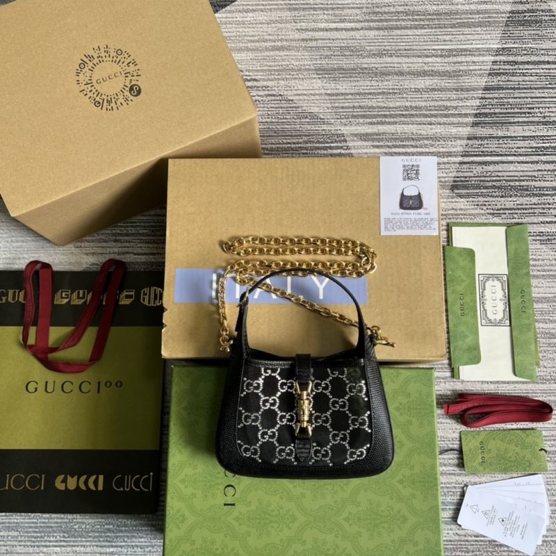 G*u*i top handle bags